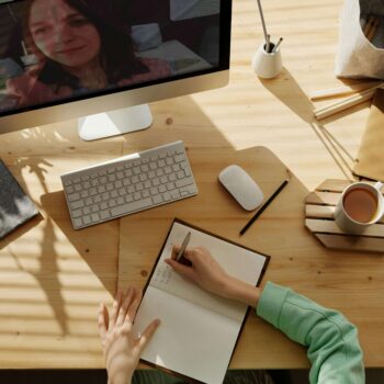 A woman at her computer taking digital marketing certifications to learn more.