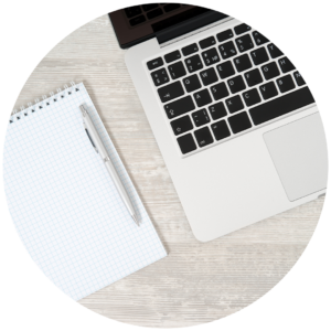 Laptop and note pad used as tools for SEO consulting and website copywriting services.