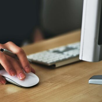 A financial copywriter proofreading her website copy on a computer to make sure it is easy to read.