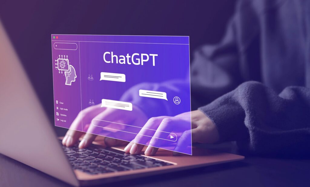 Person typing on a laptop with a virtual ChatGPT interface displaying chat bubbles and a digital brain icon—ideal for a freelance SEO consultant optimizing content strategies.